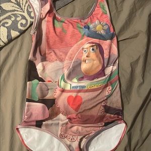 Buzz Lightyear as Mrs. Nesbitt—snap-crotch bodysuit.